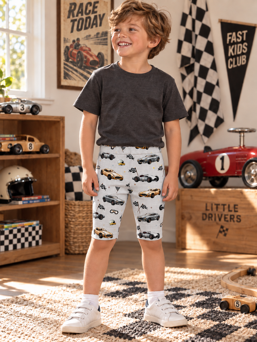 Boy wearing Boys Race Cars cotton leggings-style shorts